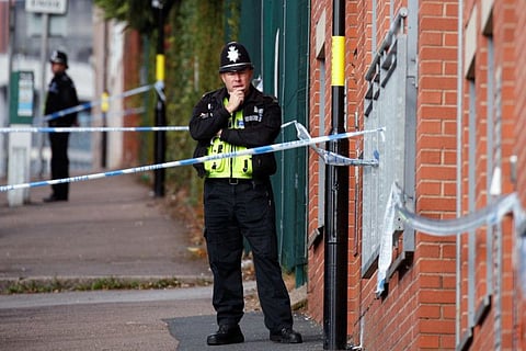 Police tape and police officers are seen near the scene of reported stabbings in Birmingham, Britain, September 6, 2020.  