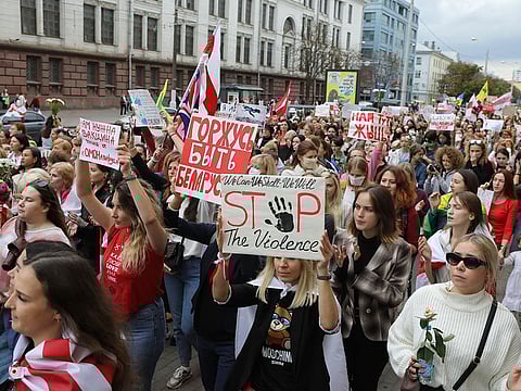 Women march during an opposition rally to protest the official presidential election results in Minsk, Belarus, on Saturday. 