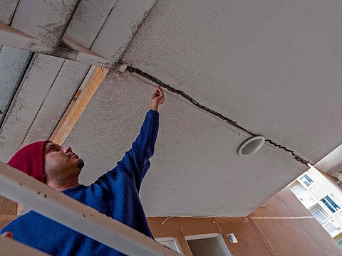 File photo: A man shows a crack on the cielieng of a building after a 6.8-magnitude quake in Copiapo, northern Chile on September 1, 2020.  