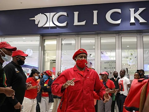Members of the opposition Economic Freedom Front (EFF) protest outside a branch of drug store chain Clicks in Johannesburg, South Africa, September 7, 2020. 