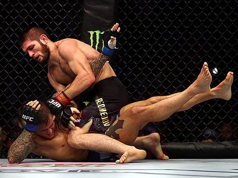 Khabib Nurmagomedov (on top) and Dustin Poirier during their pathbreaking event at Yas Island last year. 