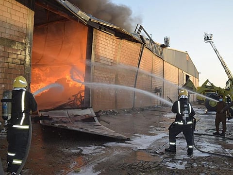 Firemen battle a blaze in a warehouse in Riyadh.