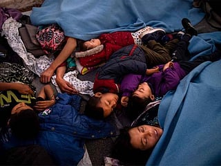 Thousands spend third night in the open after Greek migrant camp fire