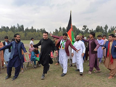 In this file photo taken on February 28, 2020, youths dance as they celebrate the reduction in violence, in Jalalabad. The Taliban will hold talks with the Afghan government on September 11, 2020, but it will be no easy task for the foes to bridge their ideological differences and resolve the bitter legacy of two decades of war. 