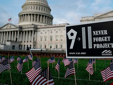 Democratic presidential nominee and former Vice-President Joe Biden and his wife Jill, former New York City Mayor Michael Bloomberg, U.S. Vice-President Mike Pence and his wife Karen all stand with their hands over their hearts as they attend ceremonies marking the 19th anniversary of the September 11, 2001 attacks on the World Trade Center at the 911 Memorial & Museum in New York City, New York, US, September 11, 2020. 