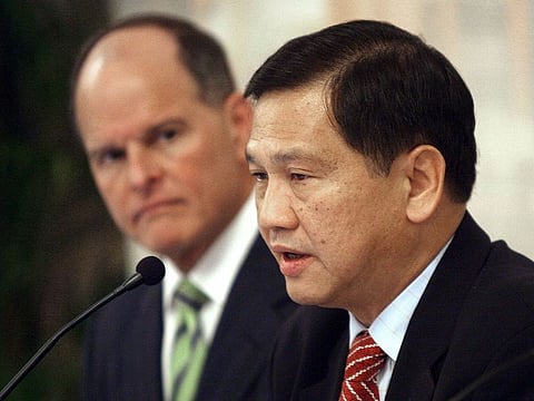 Liew Mun Leong (R) speaks after signing an agreement with US gaming giant MGM Mirage in Singapore