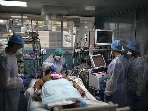  A medical crew works around a patient affected with COVID-19 in a Marseille hospital, southern France, Thursday, Sept.10, 2020.