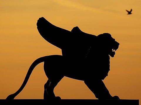 A statue of a lion is silhouetted against the sky the day before the award ceremony of the 77th Venice Film Festival in Venice, Italy September 11, 2020. 