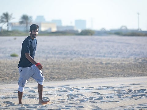 Mumbai Indians' Jasprit Bumrah relaxes on the beach in Abu Dhabi.