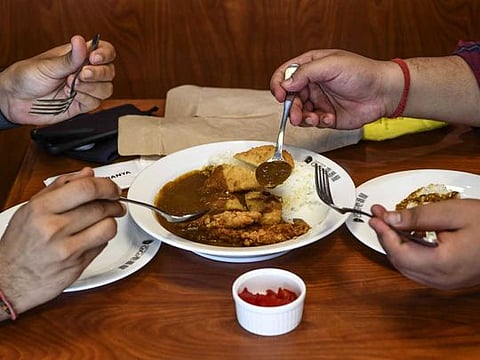 US Democratic vice-presidential candidate Senator Kamala Harris and her husband Doug Emhoff visit Amaize, a restaurant in Doral, Florida, on September 10, 2020.