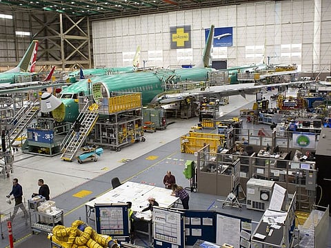 Boeing aircraft on assembly line. Boeing Co. set a target of designing and certifying its jetliners to fly on 100% sustainable fuels by 2030.