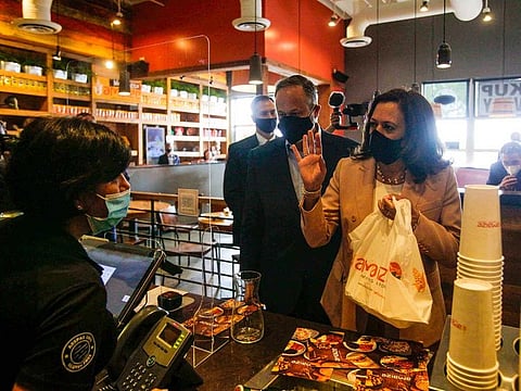 US Democratic vice-presidential candidate Senator Kamala Harris and her husband Doug Emhoff visit Amaize, a restaurant in Doral, Florida, on September 10, 2020.