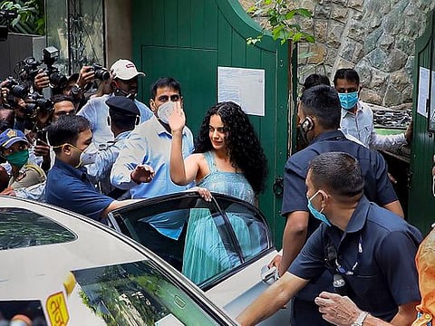 Mumbai: Bollywood actor Kangana Ranaut waves as she arrives at her office, where the Brihanmumbai Municipal Corporation conducted a demolition drive, at Pali Hill in Mumbai, Thursday, Sept. 10, 2020.