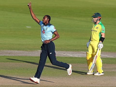 England's Jofra Archer celebrates the dismissal of Australia's David Warner.