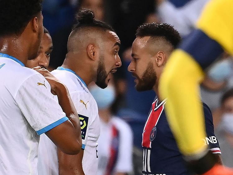 Paris Saint-Germain's Brazilian forward Neymar argues with Marseille's Dimitri Payet  