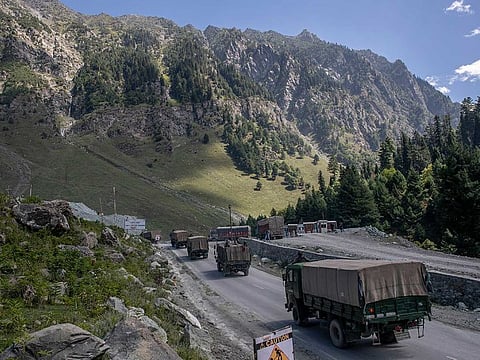 An Indian army convoy moves on the Srinagar- Ladakh highway at Gagangeer, northeast of Srinagar, Wednesday, Sept. 9, 2020. 