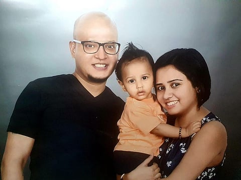Retesh James Gupta with his wife Aparupa Ganguly and son Vivaan Aiden Gupta. Dubai Police honoured Gupta for returning a bag full of cash and jewellery to police. 