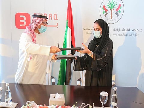 Jassim Al Hammadi, CEO of Osool with Aisha Al Hosani, Director of Support Services Department 