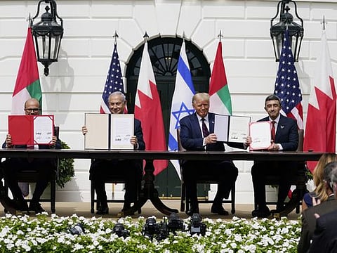 US President Donald Trump, centre, with from left, Bahrain Foreign Minister Khalid bin Ahmed Al Khalifa, Israeli Prime Minister Benjamin Netanyahu, and UAE Foreign Minister Abdullah bin Zayed al-Nahyan, during the Abraham Accords signing ceremony on the South Lawn of the White House, Tuesday, Sept. 15, 2020, in Washington