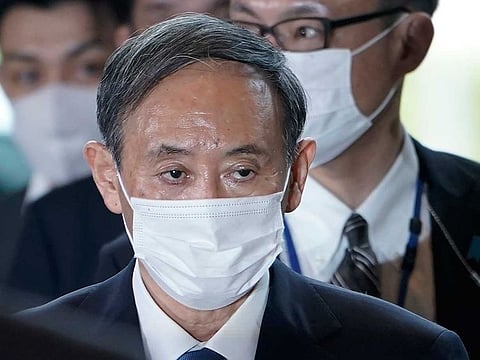 Yoshihide Suga arrives at the prime minister's office after being formally elected Japan’s prime minister in a parliamentary vote, succeeding Shinzo Abe, Wednesday, Sept. 16, 2020, in Tokyo. 
