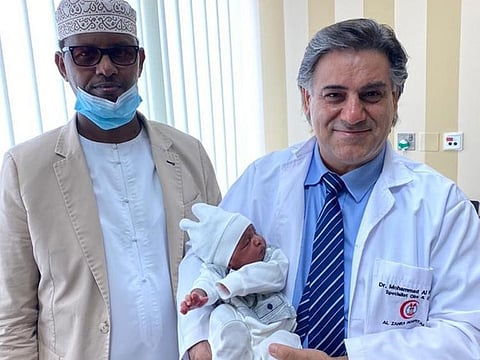Sharjah resident Noor Eldeen, 55, with Dr Mohammad El Hassoun and the new born baby, Maher