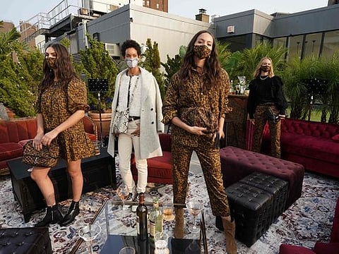 Models present Rebecca Minkoff at a New York Fashion Week (NYFW) presentation on September 15, 2020 