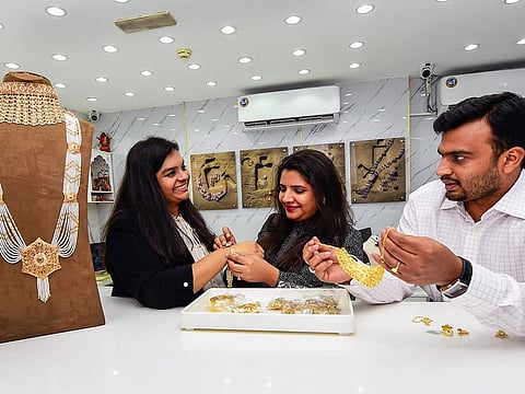 All in the family... Khushboo Jewels's owners, Khushboo Agarwal (left), Sahil Agarwal (right) and Ravina Agarwal at the outlet in Deira Gold Souq.