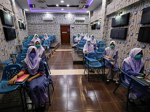 Students keep safe distance while attending an audio-visual class in Karachi, Pakistan (File)