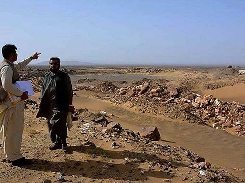 In this March 18, 2017 file photo, local officials visit the gold and copper mine site, in Reko Diq district in southwestern Pakistan's Balochistan province. 