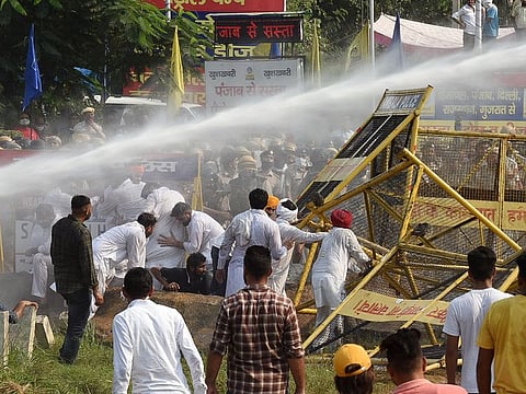 Police use water cannon to disperse Youth Congress workers and farmers protesting over Farm Bills, in Ambala on Sunday. 