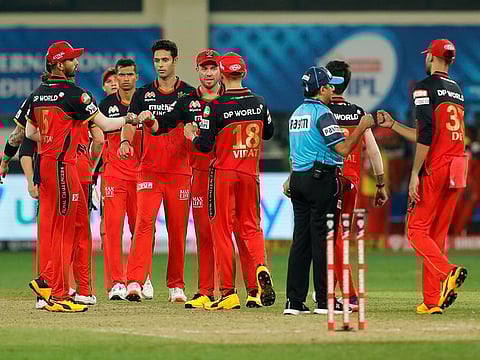 Royal Challengers Bangalore players celebrate their victory. 