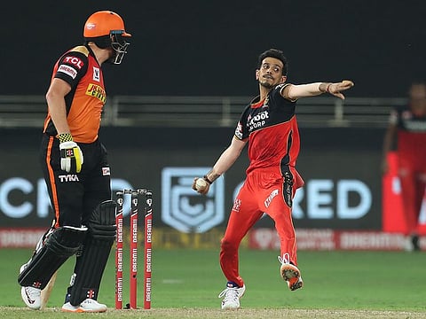 Yuzvendra Chahal of Royal Challengers Bangalore bowls against Sunrisers Hyderabad in the Indian Premier League (IPL 13) at the Dubai International Cricket Stadium, UAE, on September 21, 2020.  