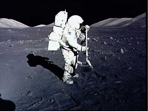 In this December 10, 1972, image obtained from NASA, astronaut Harrison Schmitt collects lunar rock samples at the Taurus-Littrow landing site on the moon during the Apollo 17 mission. 