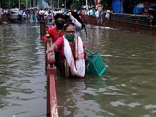 In Pictures: Rains lash Mumbai; traffic disrupted, trains cancelled