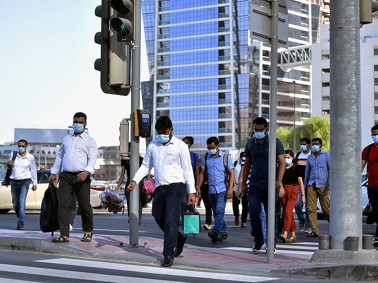 Stock Dubai office staff working street