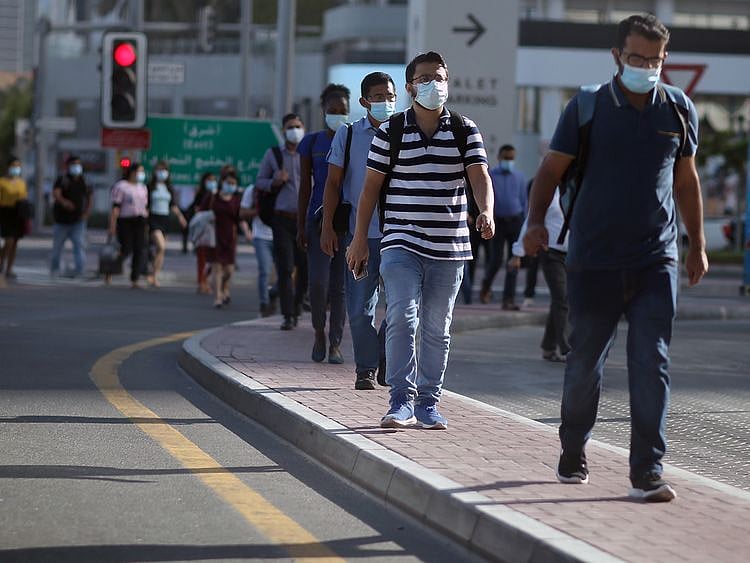 Stock Dubai office staff working street