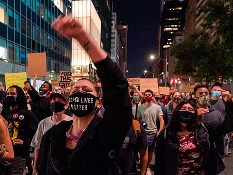 Protesters march through the streets after a judge announced the charges brought by a grand jury against Detective Brett Hankison, one of three police officers involved in the fatal shooting of Breonna Taylor in New York City on September 23, 2020. 