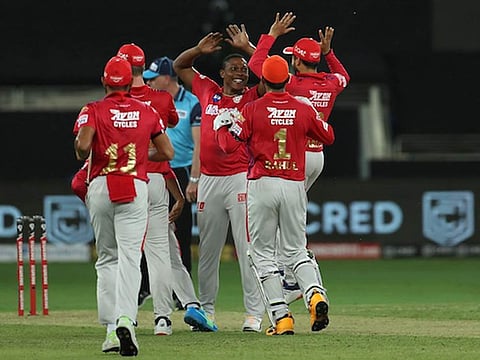 Sheldon Cottrell of Kings XI Punjab celebrates the wicket of Virat Kohli  during the Indian Premier League (IPL) match between Kings XI Punjab and Royal Challengers Bangalore