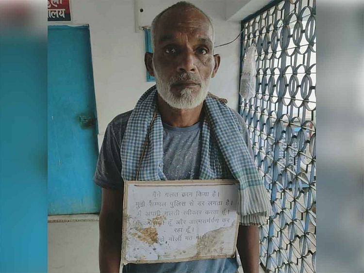 Man surrenders in UP with 'Don't Shoot Me' placard