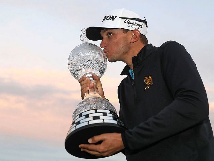 USA's John Catlin celebrates with the trophy after winning The Dubai Duty Free Irish Open 