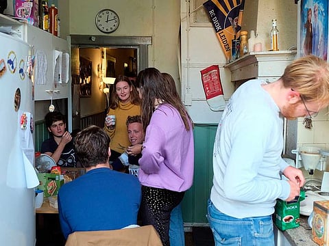 Dutch students chat in the kitchen of their shared house in Leiden, Netherlands on Friday, Sept. 25, 2020. The coronavirus pandemic is hitting students hard in Leiden, the Netherlands' oldest university city. 