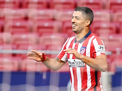 Luis Suarez celebrates after scoring during the Spanish league football match against Granada FC at at the Wanda Metropolitano stadium in Madrid on September 27, 2020.