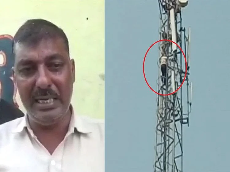 Man climbs up mobile tower