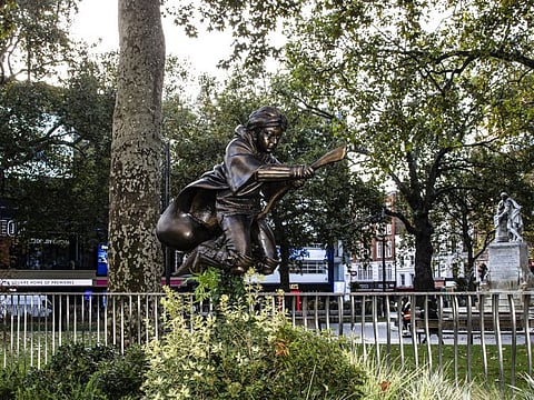 A new statue of the character Harry Potter, after it was unveiled in Leicester Square as part of the ‘Scenes in the Square’ statue trail, central London, Wednesday, Sept. 30, 2020.
