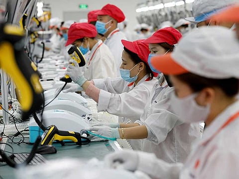 Labourers work at an assembly line to produce ventilators amid the spread of the coronavirus disease (COVID-19) at Vsmart factory of Vingroup outside Hanoi, Vietnam August 3, 2020.