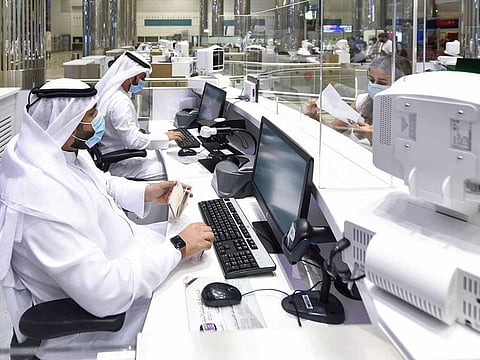 Immigration officers at Terminal 3, Dubai International Airport as Dubai reopens international travel for tourists and residents 
