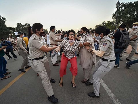 Members of All India Students Association (AISA) and Bhim Army are detained by police during a protest against the death of a Dalit woman who was gang-raped in Hathras (UP), in New Delhi, Wednesday, Sept. 30, 2020. Another Dalit woman died on the way to hospital after she was gangraped in Uttar Pradesh. 