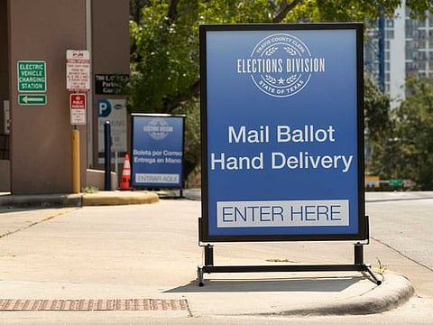 A sign indicates a drive-through ballot drop off location at the 700 Lavaca Parking Garage in Austin, Texas, on Thursday Oct. 1, 2020, shortly after an order was announced by Gov. Greg Abbott restricting such drop off locations. The number of locations where Texas voters can drop off their mail-in ballots has been vastly reduced to ensure poll security, Gov. Greg Abbott said Thursday.