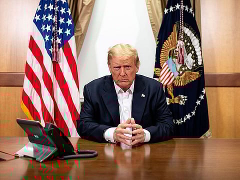 US President Donald Trump participating in a phone call in his conference room at Walter Reed National Military Medical Center in Bethesda, Maryland. 