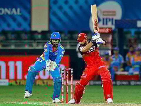 Royal Challengers Bangalore skipper Virat Kohli plays a shot during the  match against Delhi Capitals.